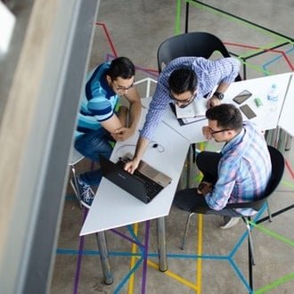 top-view-photo-of-3-men-in-front-of-laptop-2566581